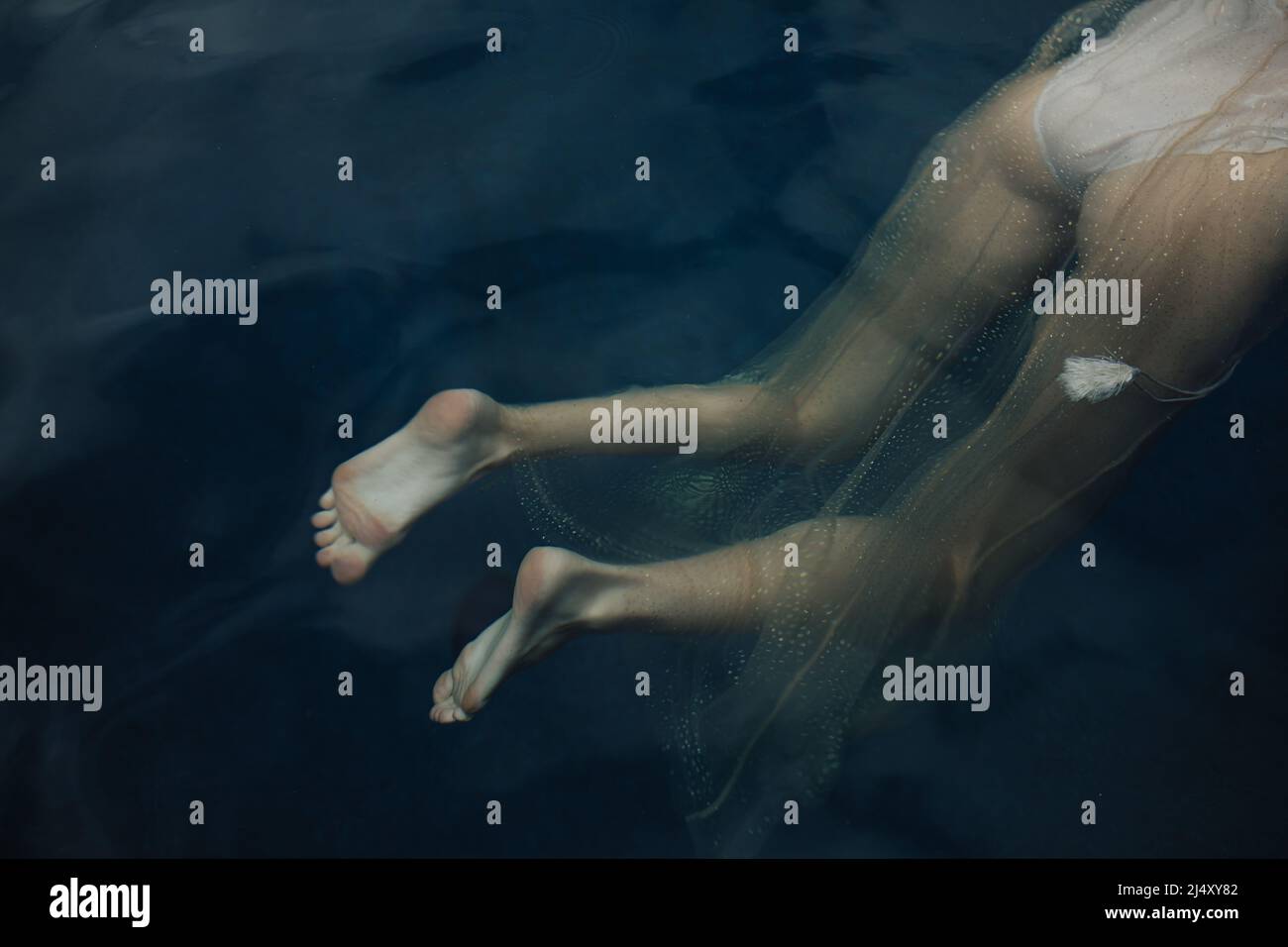 Legs And Butt Floating Underwater Wearing Sparkly Dress Stock Photo Alamy