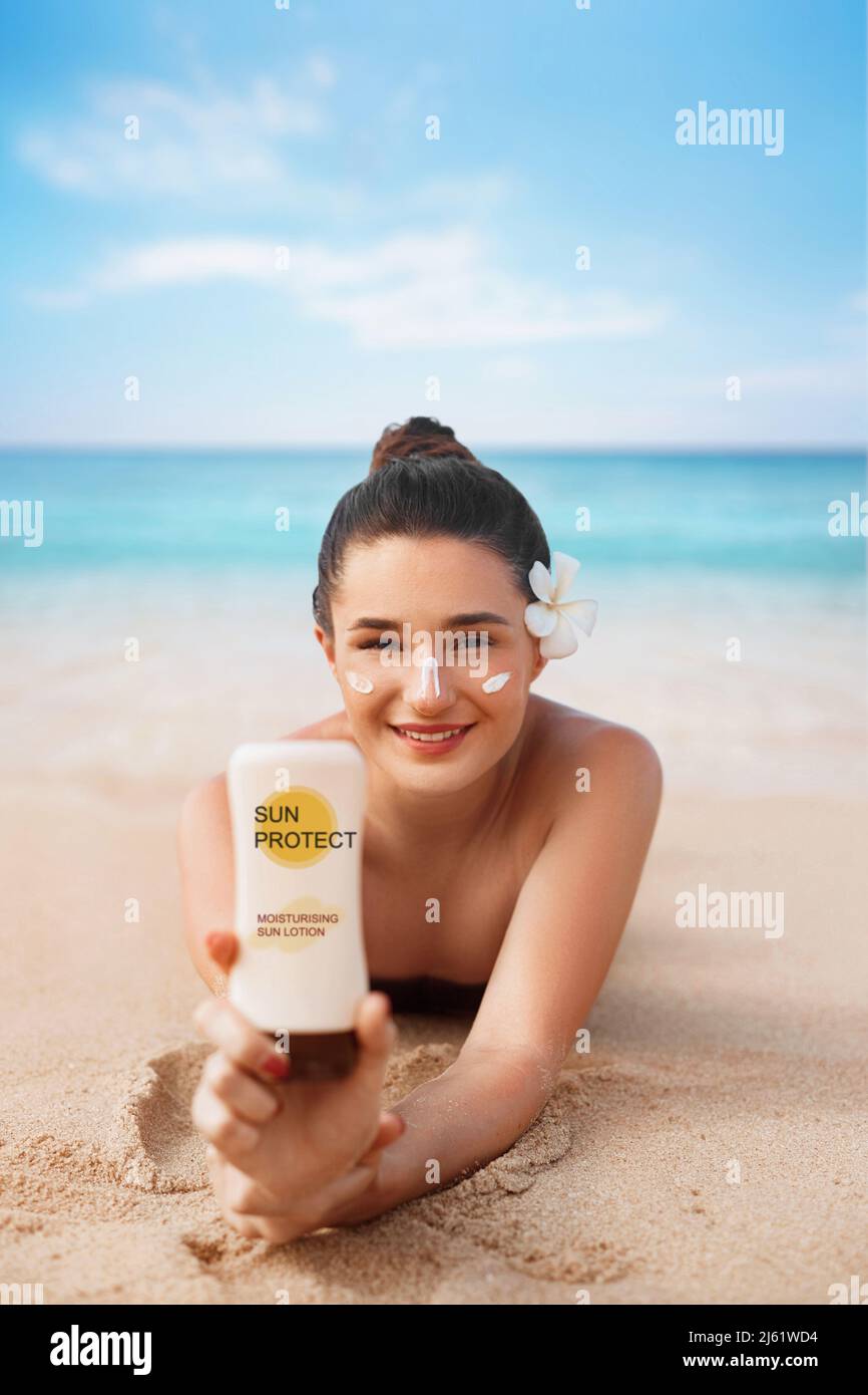 Beauty Woman In Bikini Holding Bottles Of Sunscreen In Her Hands