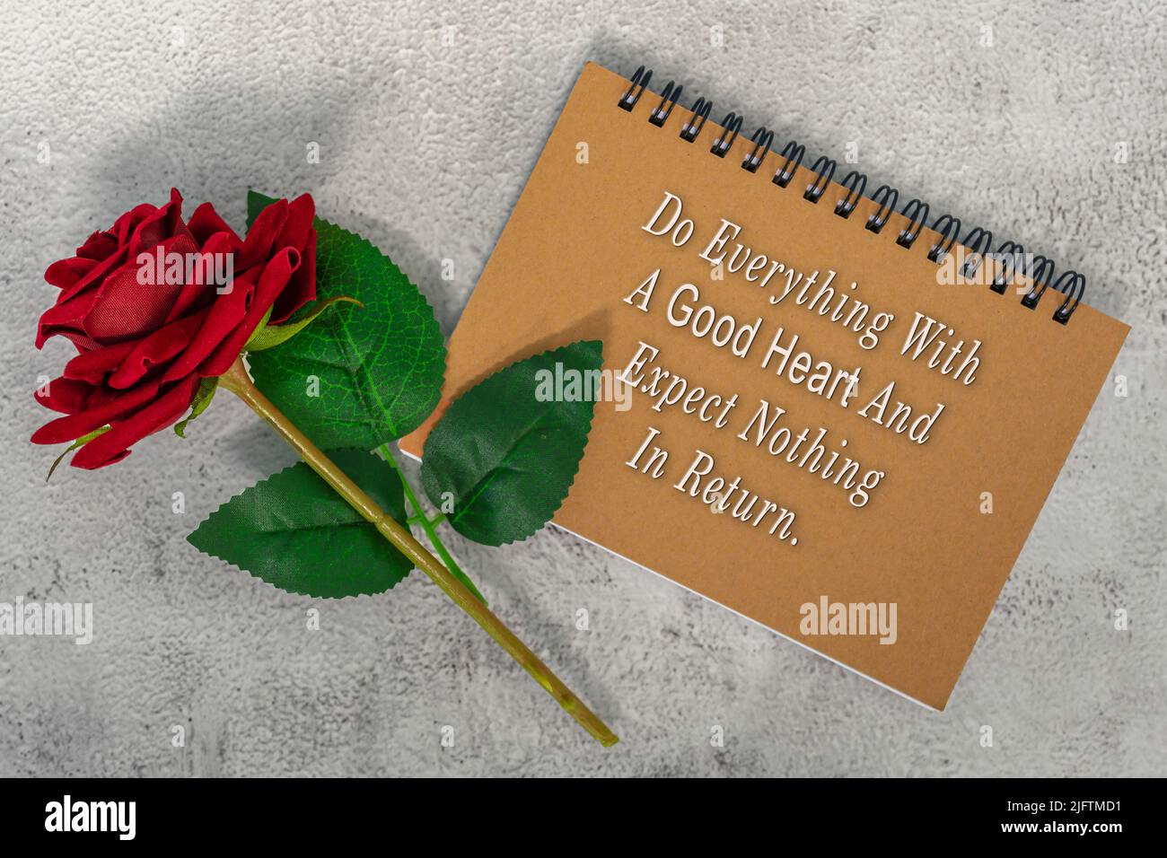 Motivational Quote On Brown Note Book With Red Roses Do Everything