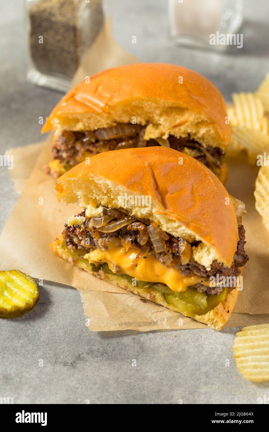 Homemade Juicy Lucy Cheeseburger With Cheddar And Chips Stock Photo Alamy