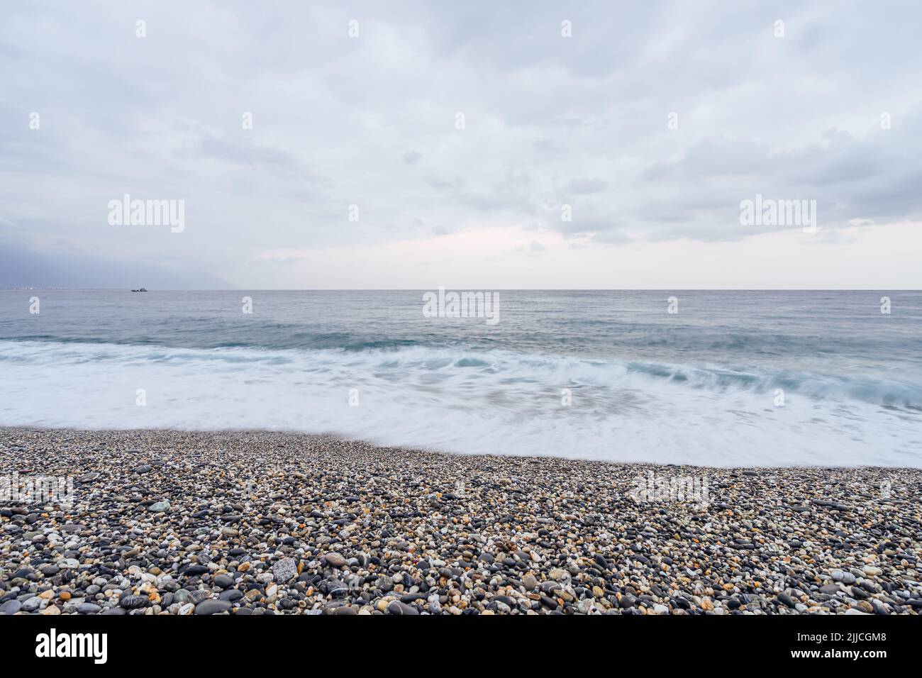 Beautiful Scenic Of Ocean With Sprawling Stone Covered Beach