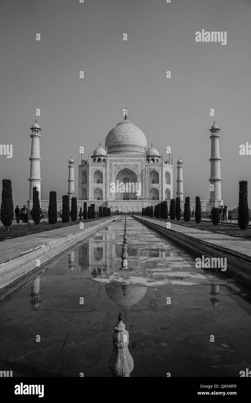 A Vertical Shot Of The Taj Mahal Mausoleum With Walkways Beside A