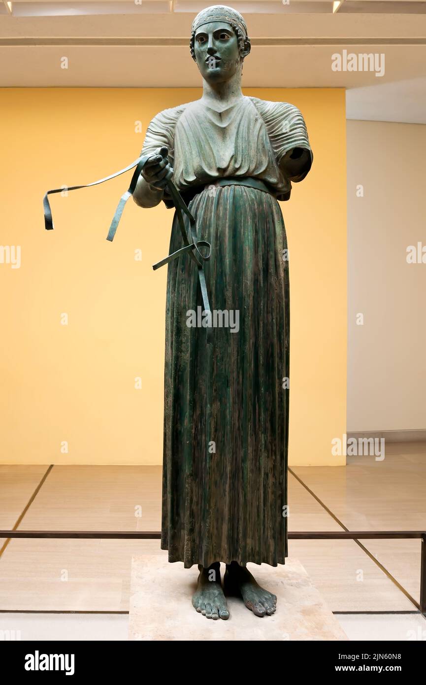 Heniokhos Charioteer Bronze Statue At The Archaeological Museum Of