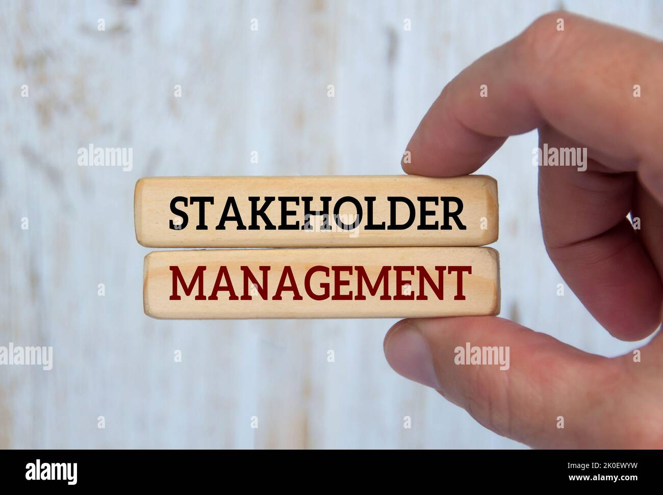 Hand Holding Wooden Blocks With Text Stakeholder Management Business