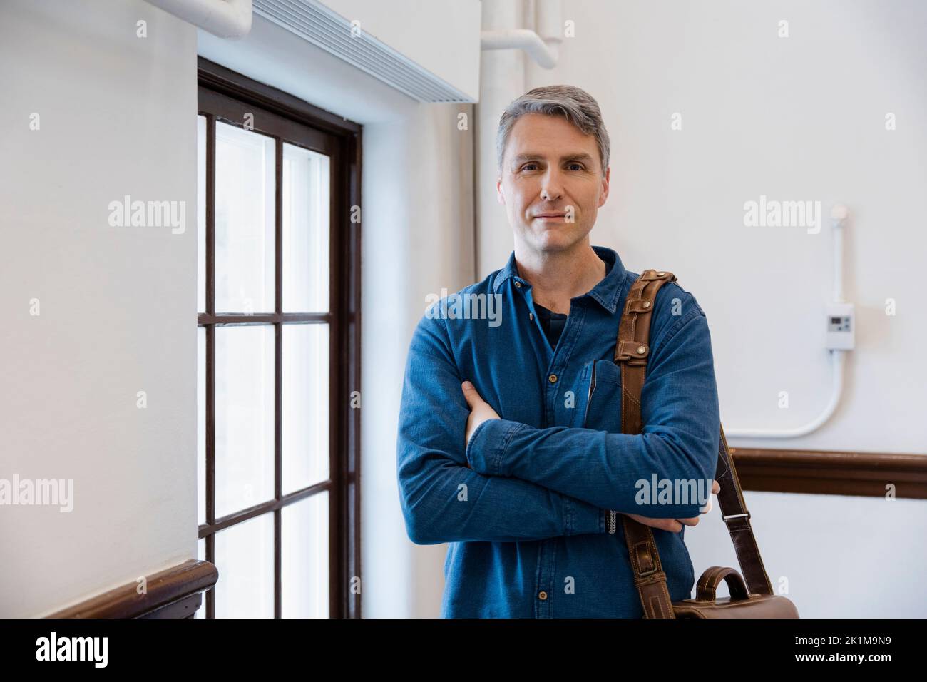 Portrait Of Mature Man With Arms Folded Stock Photo Alamy