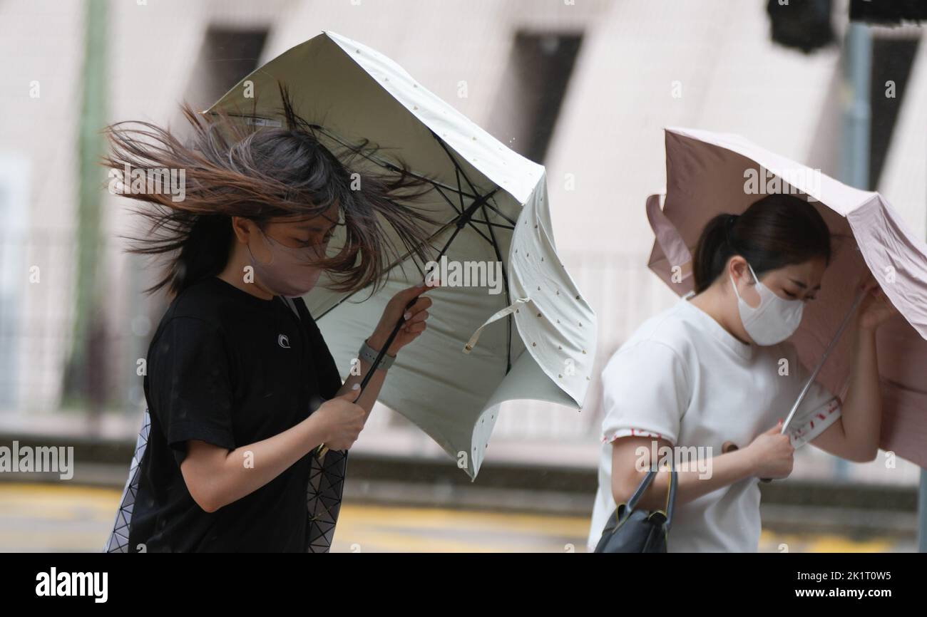 People Hold Umbrellas Against The Rainstorm In Tsim Sha Tsui The Hong