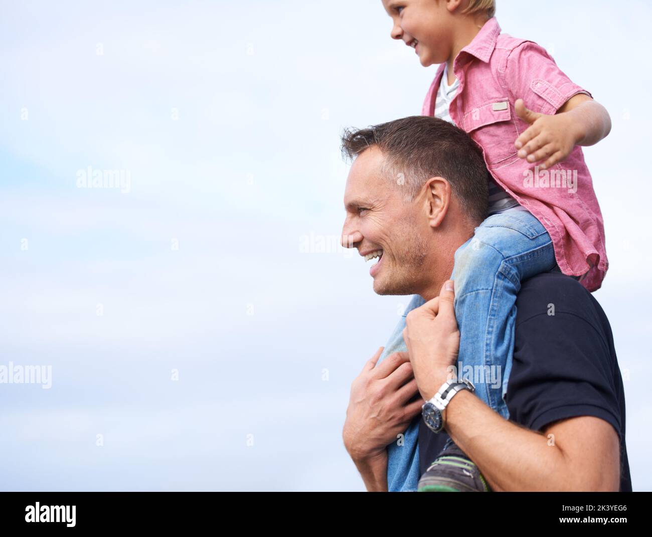 Special Moments With Dad A Handsome Father Carrying His Son On His