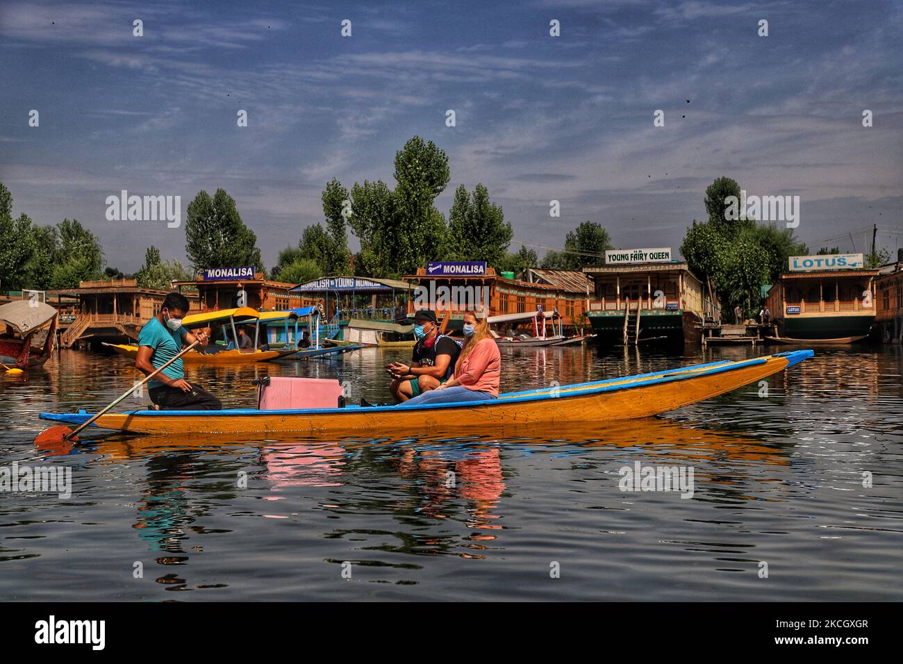 Tourists Enjoy Shikara Ride In Famous Dal Lake In Srinagar Jammu And