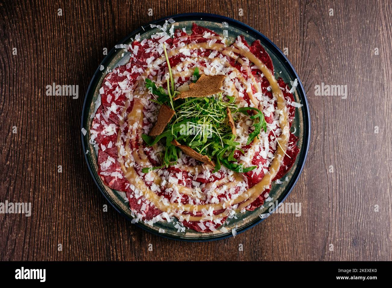 Marble Beef Carpaccio With Sauce And Herbs Stock Photo Alamy