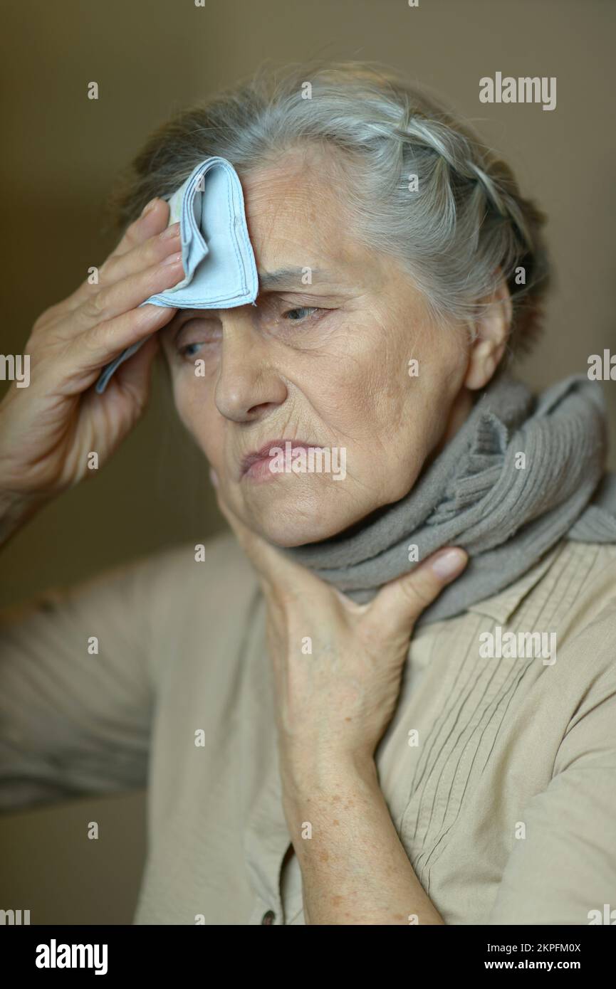 Elderly Woman Holding Her Hand To Her Throat Disease Stock Photo Alamy