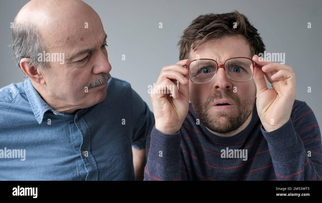 Surprised Stupefied Men Mature Father And Son In Big Glasses With Wow