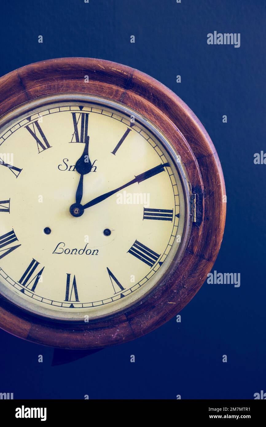 Old Fashioned Wall Clock With Roman Numerals Stock Photo Alamy