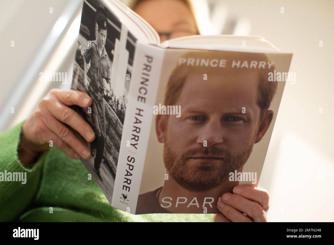 Female Reading Prince Harry Spare Memoir Autobiography Book In