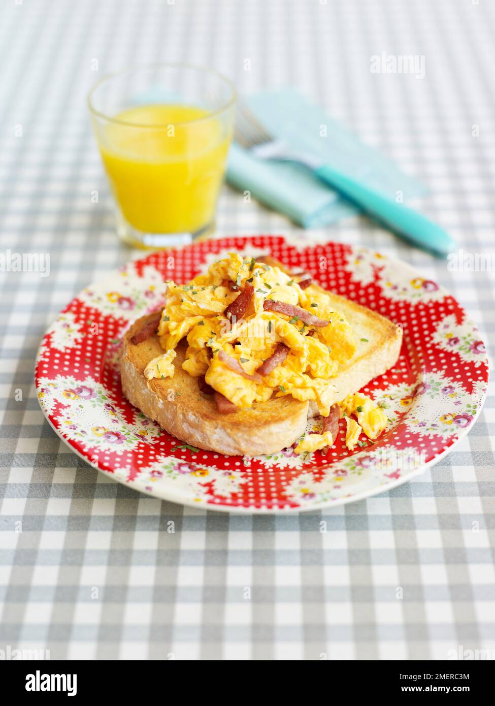 Scrambled Eggs With Streaky Bacon On Toast Orange Juice Stock Photo