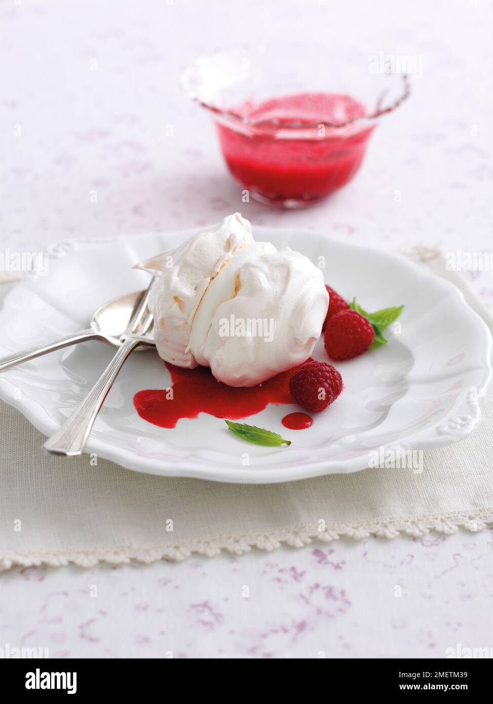 Meringues With Raspberry Coulis Stock Photo Alamy