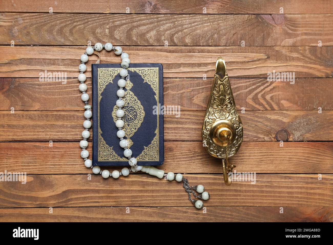 Aladdin Lamp Of Wishes Koran And Prayer Beads For Ramadan On Wooden