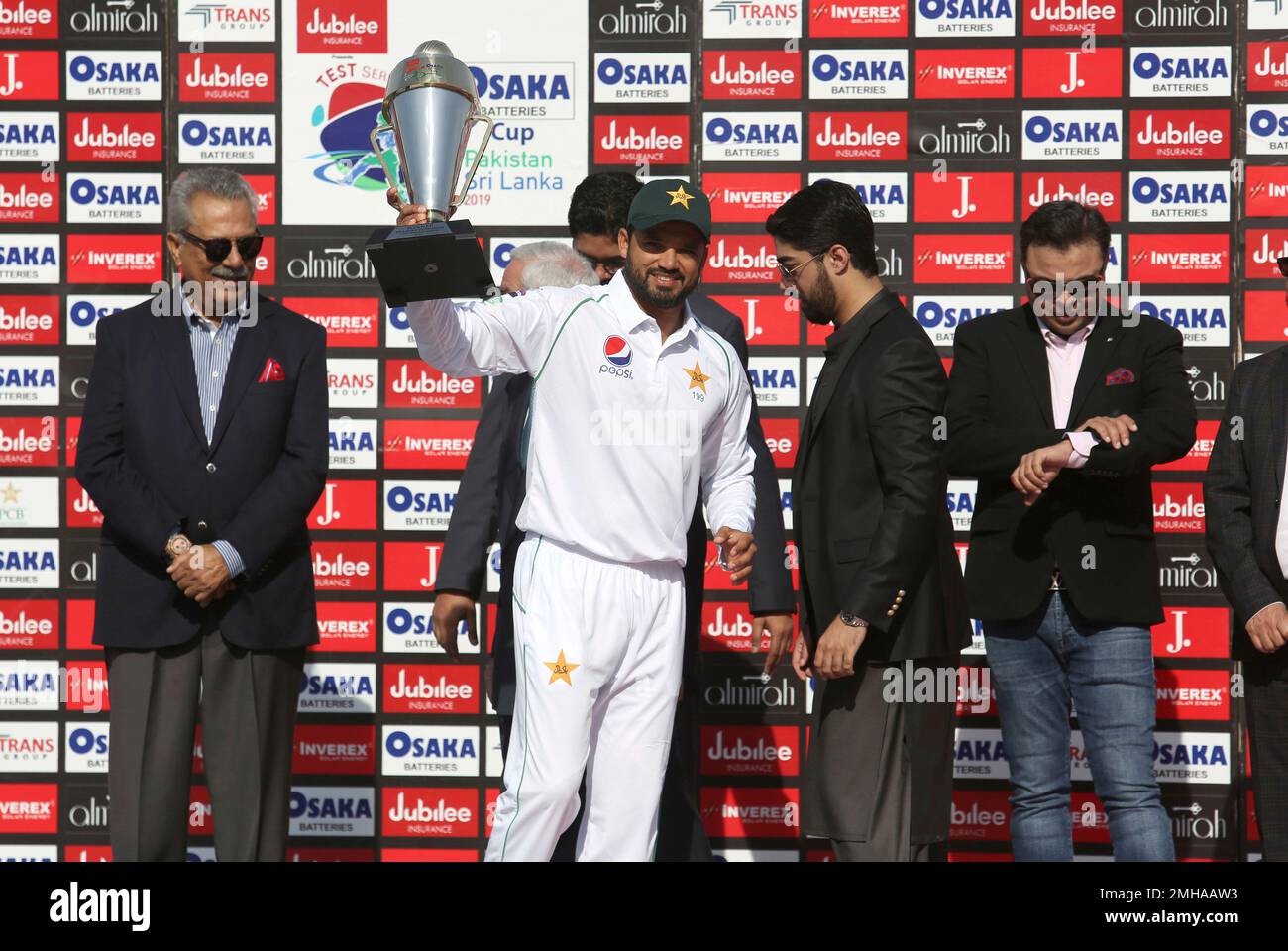 Pakistani Captain Azhar Ali Holds A Trophy To Celebrate The Victory