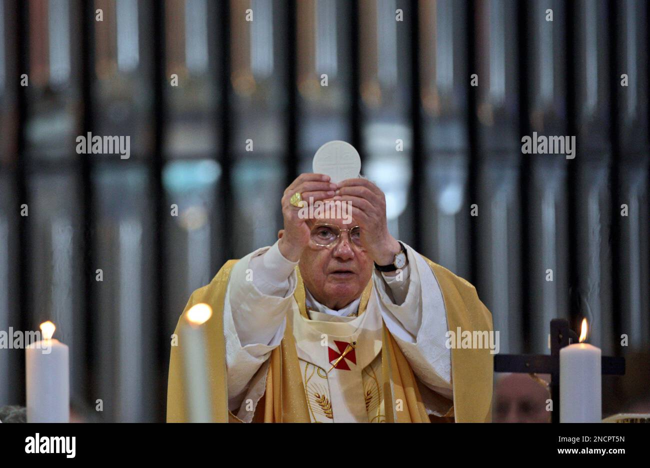 Pope Benedict XVI Left Holds The Holy Host On The Main Altar Of