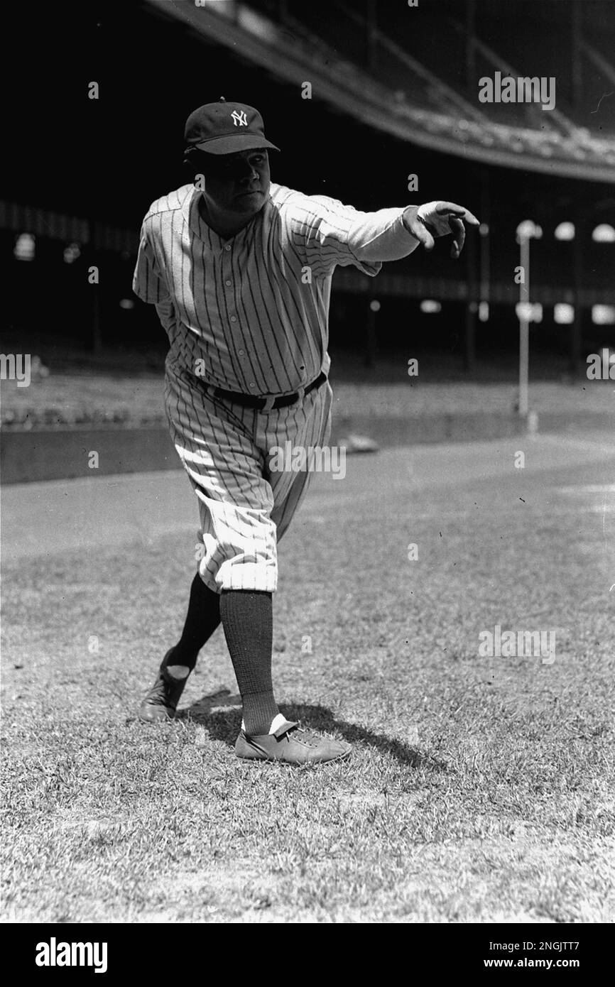 New York Yankee Outfielder Babe Ruth Shown In A Posed Pitching Stance