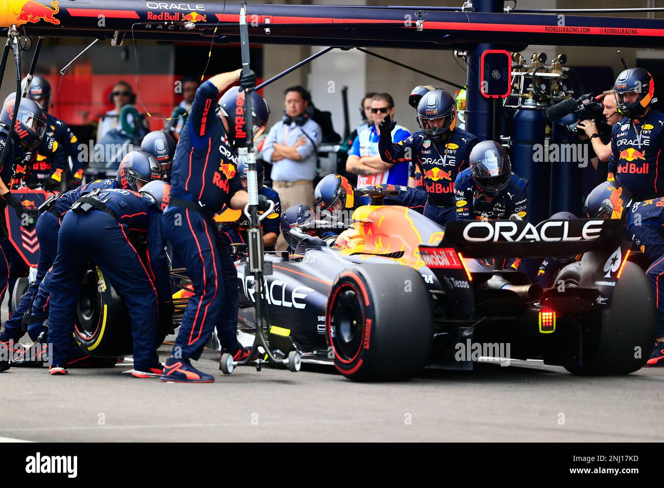 Red Bull Pit Crew Work On The Race Car Of Driver Sergio Perez Of