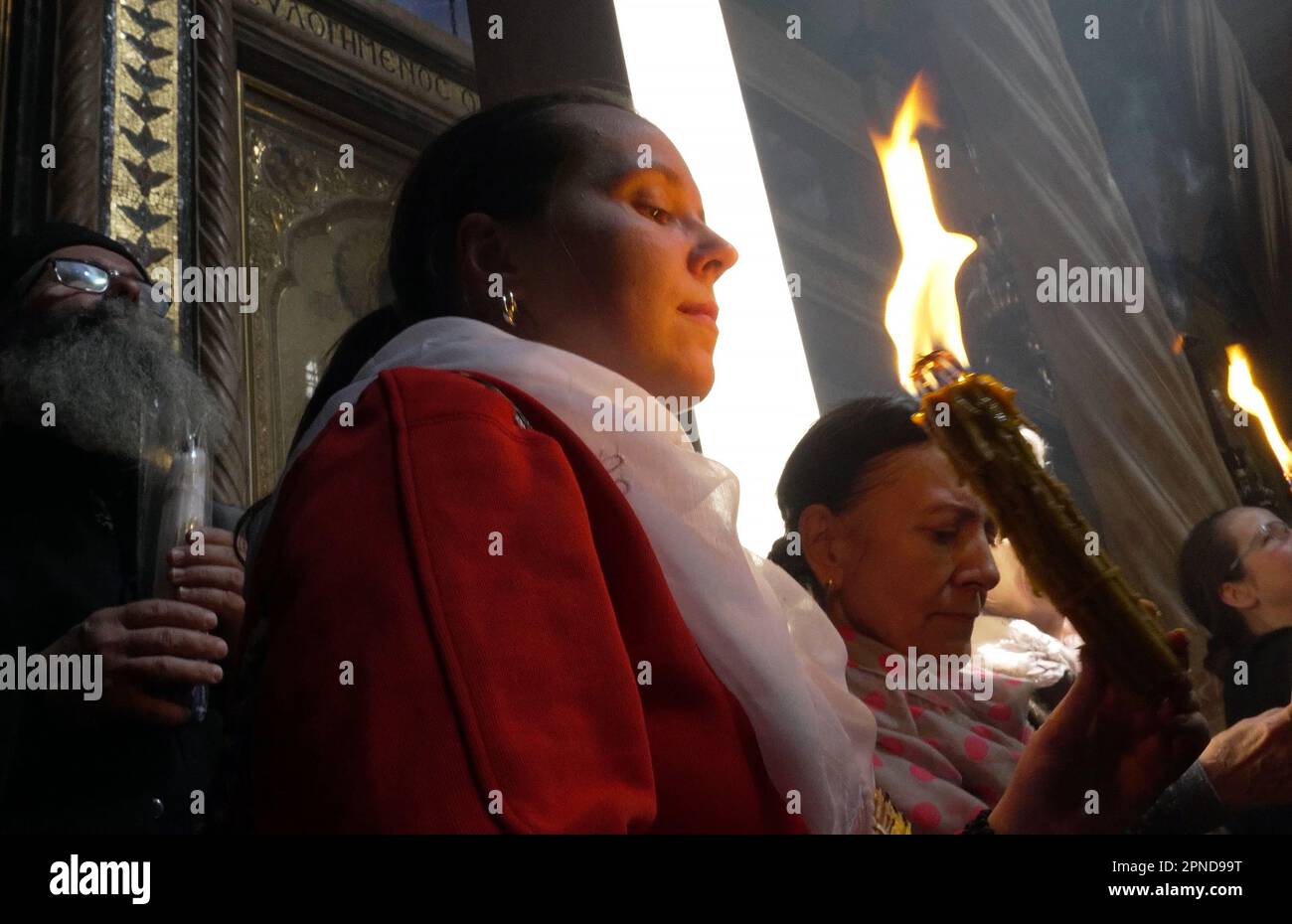 Orthodox Christian Worshipers Hold Candles Lit With Miraculous Lighting