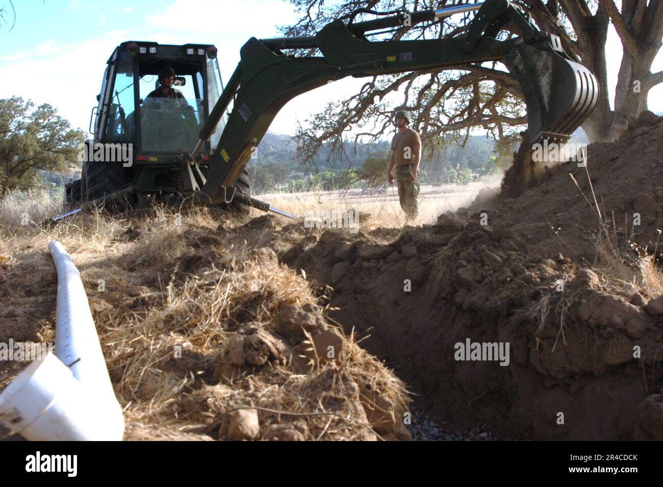 US Navy Construction Electrician 2nd Class Supervises Equipment