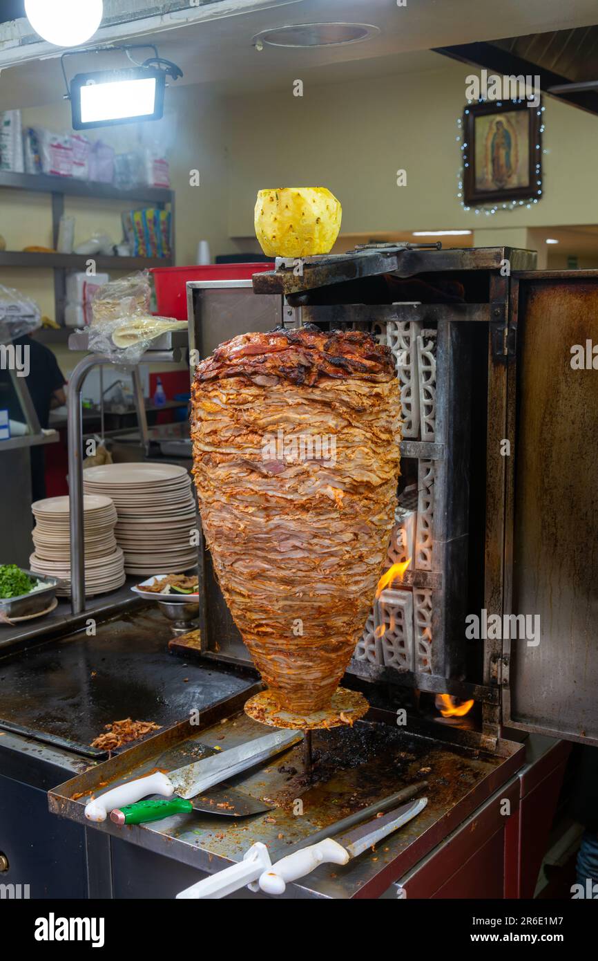 Meat Grilling On Vertical Kebab Spit In Fast Food Street Restaurant