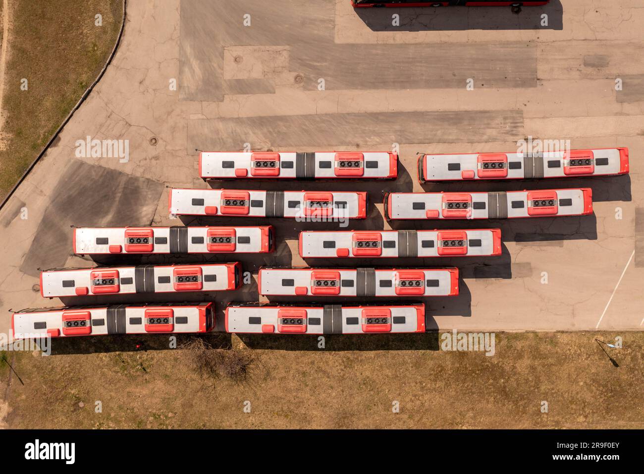 Drone Photography Of Bus Parking Lot And Lot Of Buses In A Line During