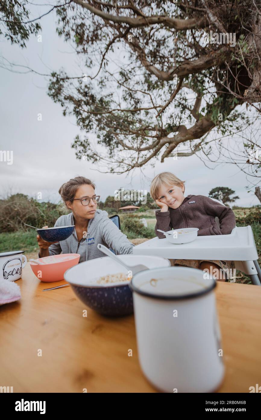 Mother And Son Having Breakfast At A Campsite Stock Photo Alamy