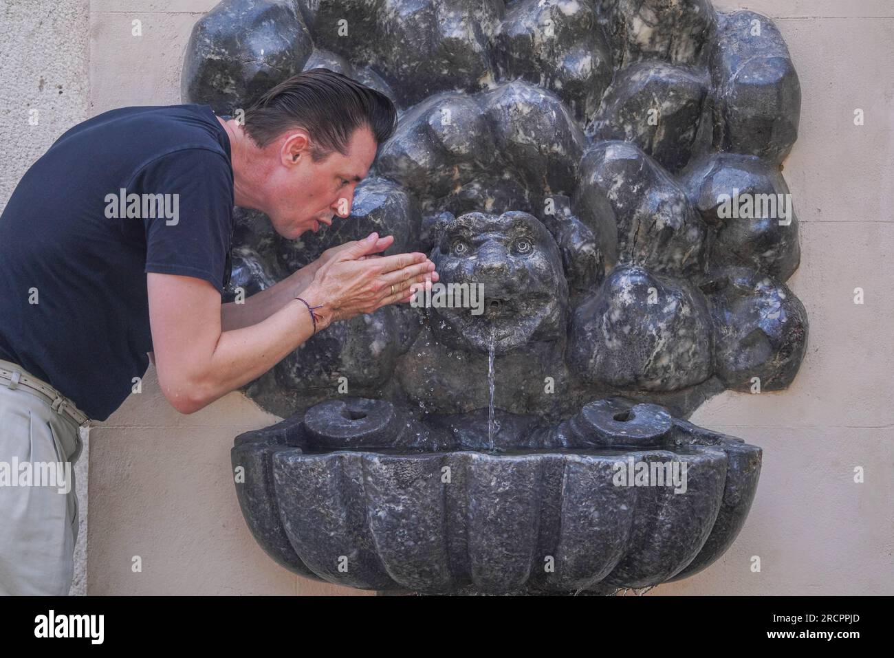 Rome Italy July A Man Cools Himself At A Gargoyle Fountain On