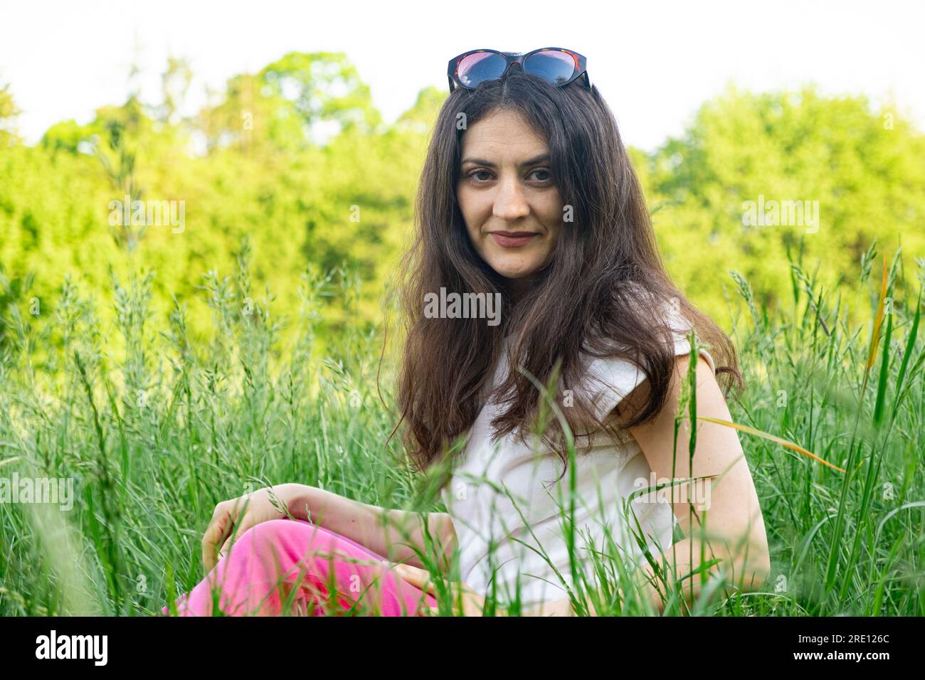 Portrait Of A Year Old Brunette Woman Looking At The Camera Smiling