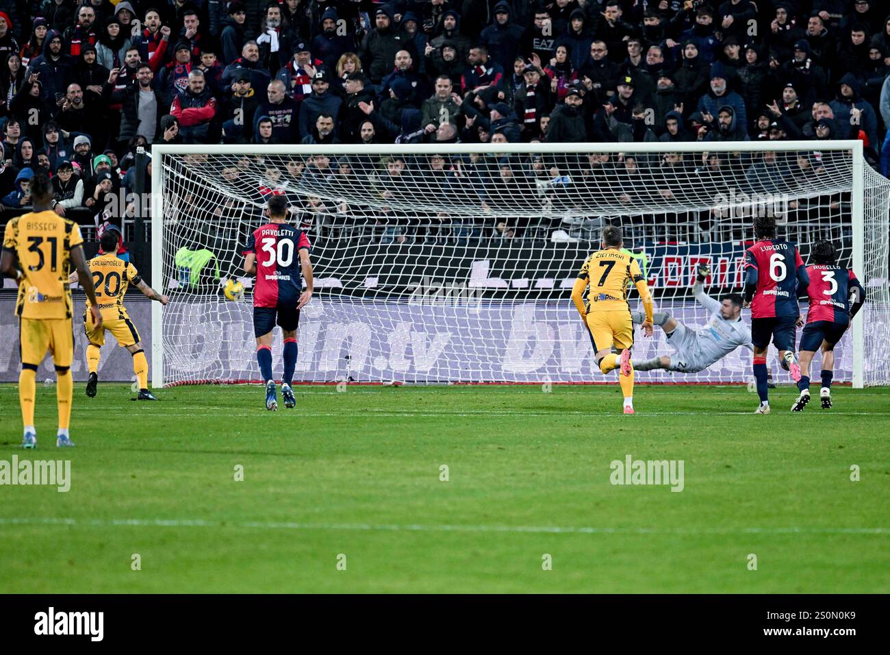 Inter Milan s Hakan Çalhanoglu scores his side s third goal by penalty