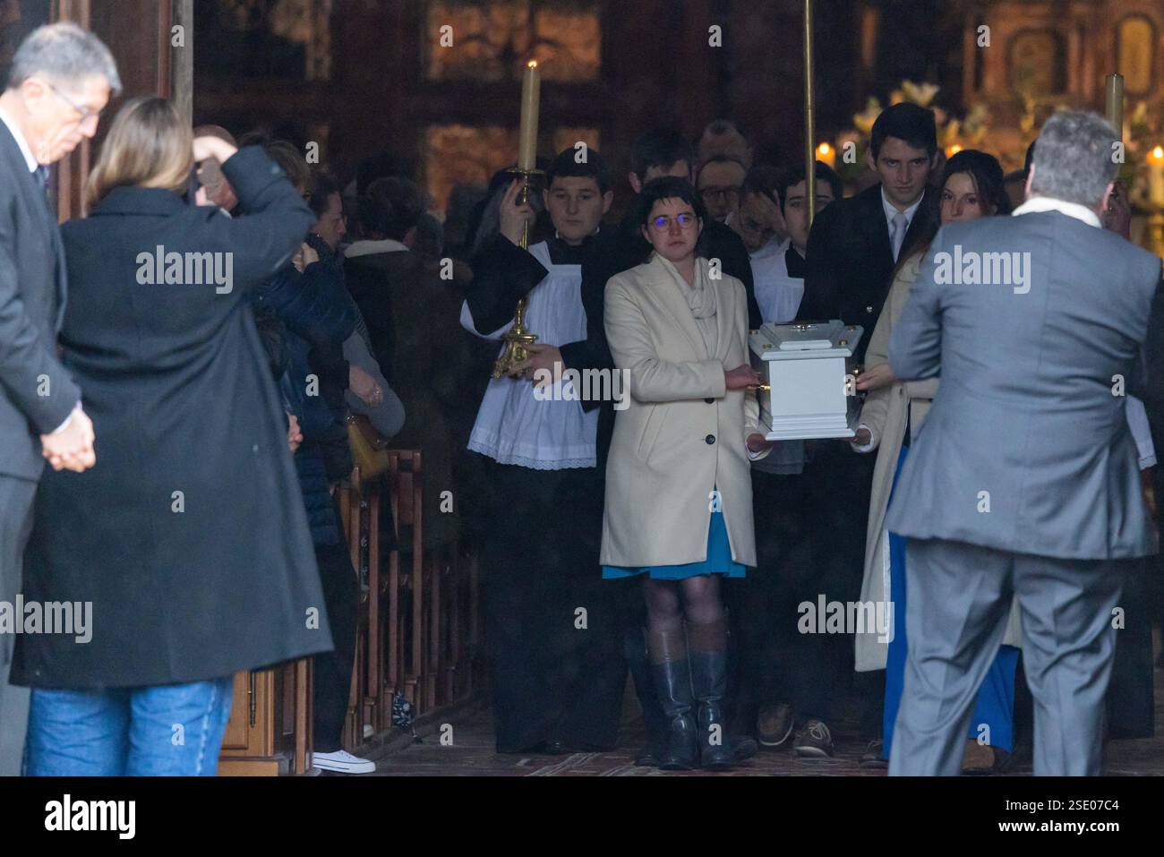 A Pall Bearer Carries The Coffin Next To Marie And Colomban Soleil