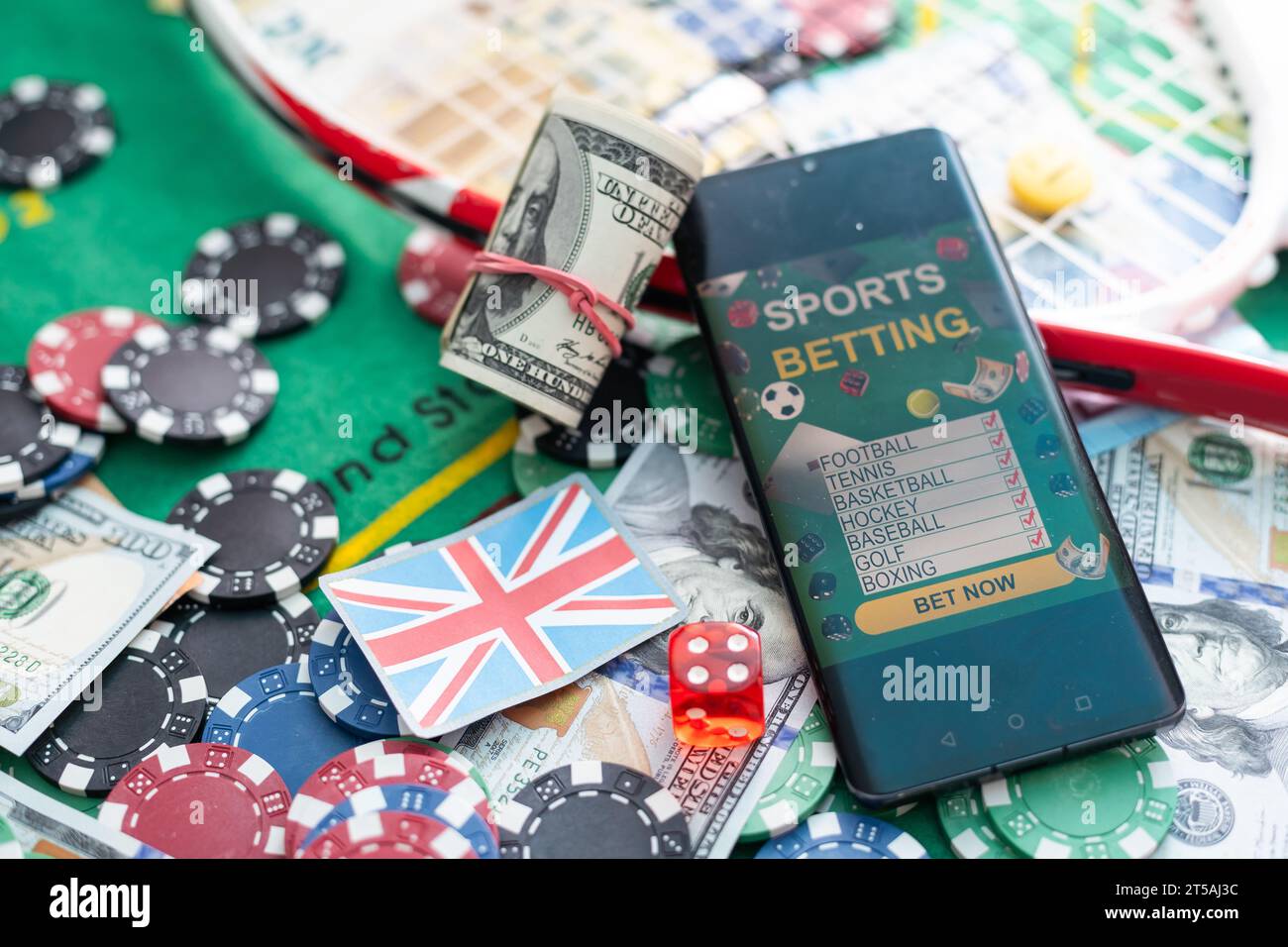 Smartphone with poket table on screen, playing cards and chip cards on ...