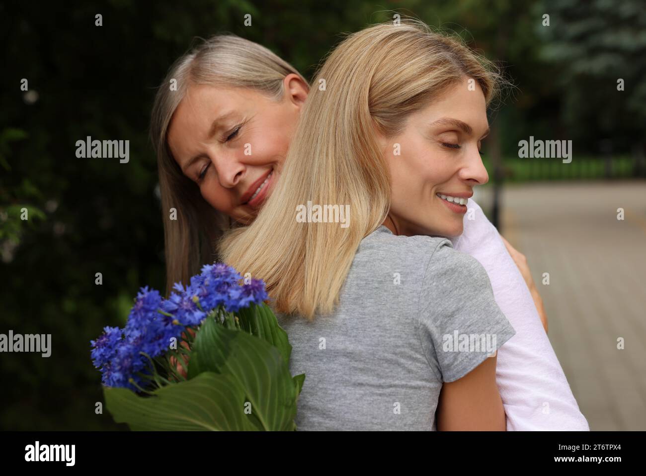 Happy Mature Mother And Her Daughter Hugging Outdoors Stock Photo Alamy