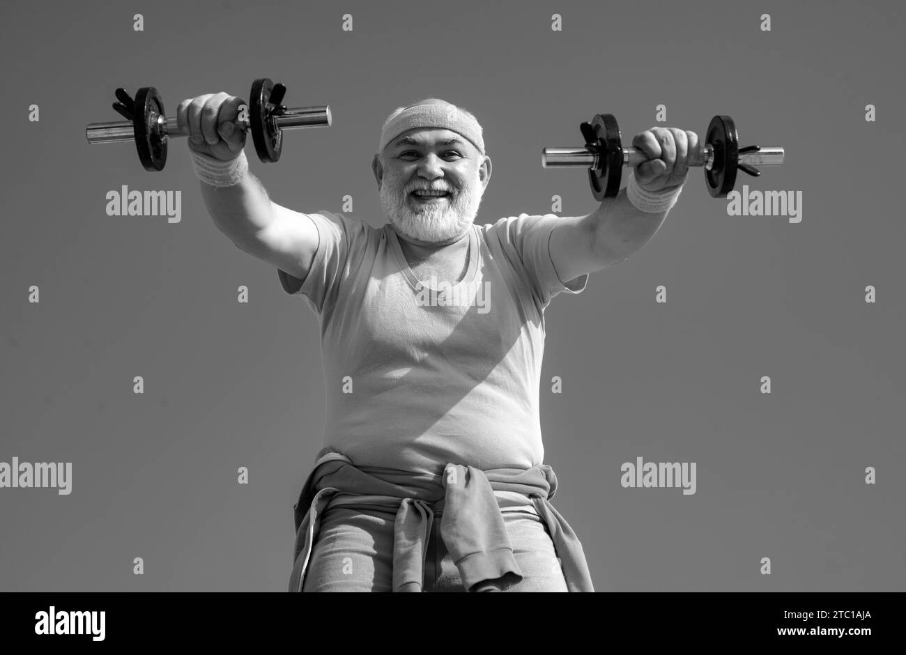 Senior Man Lifting Weights Senior Man In Gym Working Out With Weights