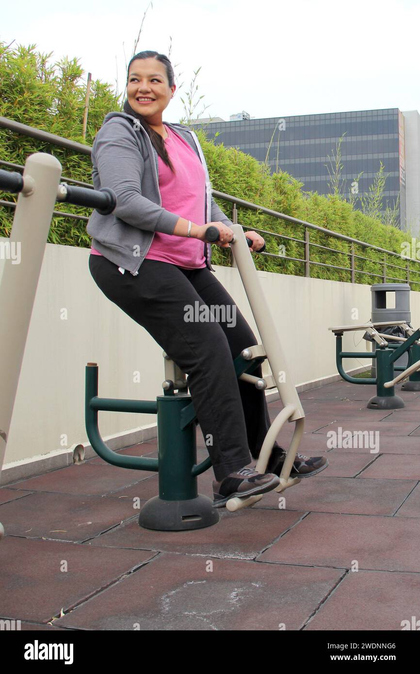 Year Old Latina Woman Exercises On Public Equipment In The Roof