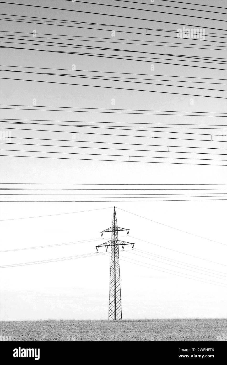 A High Voltage Pylon With Many High Voltage Lines Above It Stock Photo