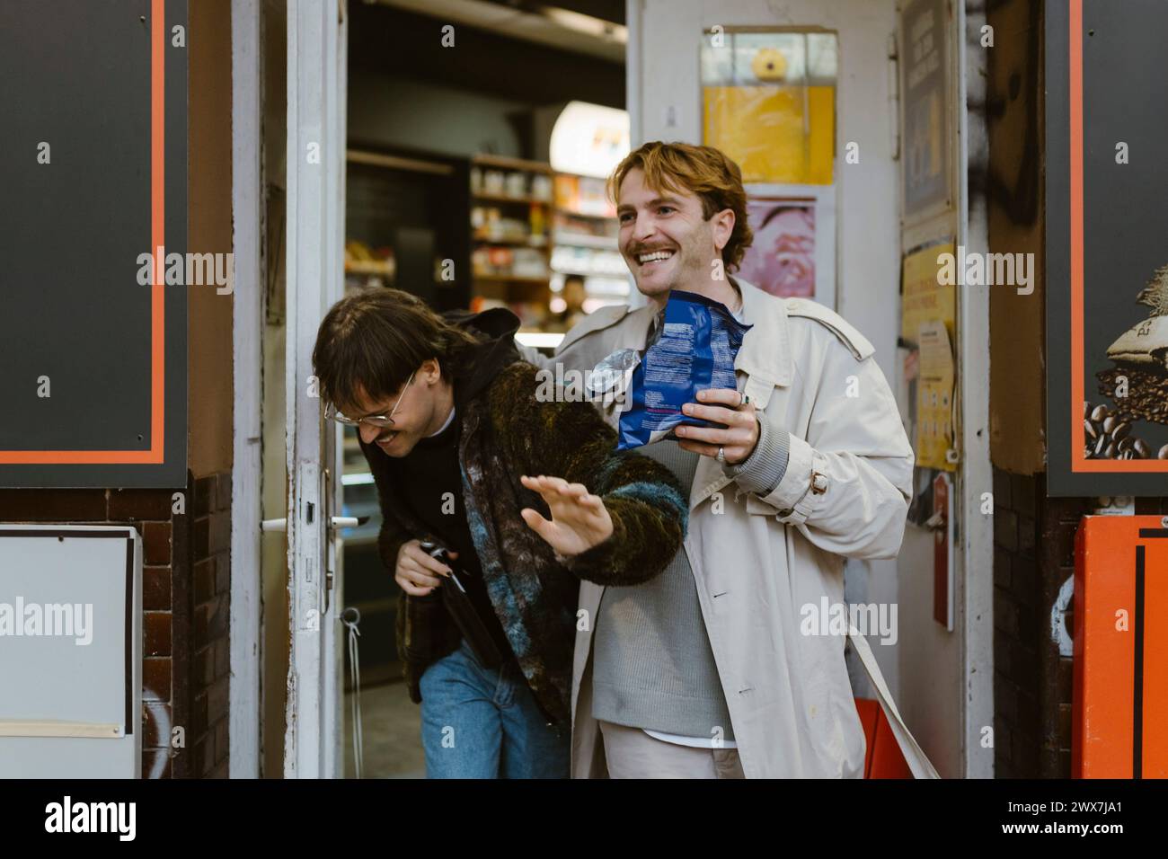 Happy Gay Couple Laughing While Leaving From Supermarket Stock Photo Alamy