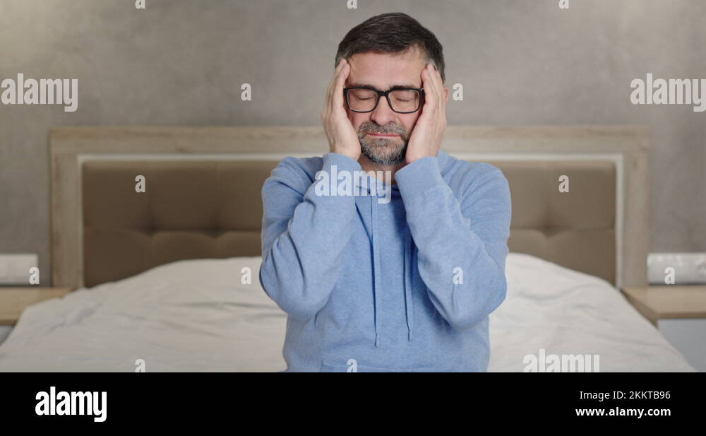 Middle Aged Man Suffering From Headache Mature Man In Glasses Touching