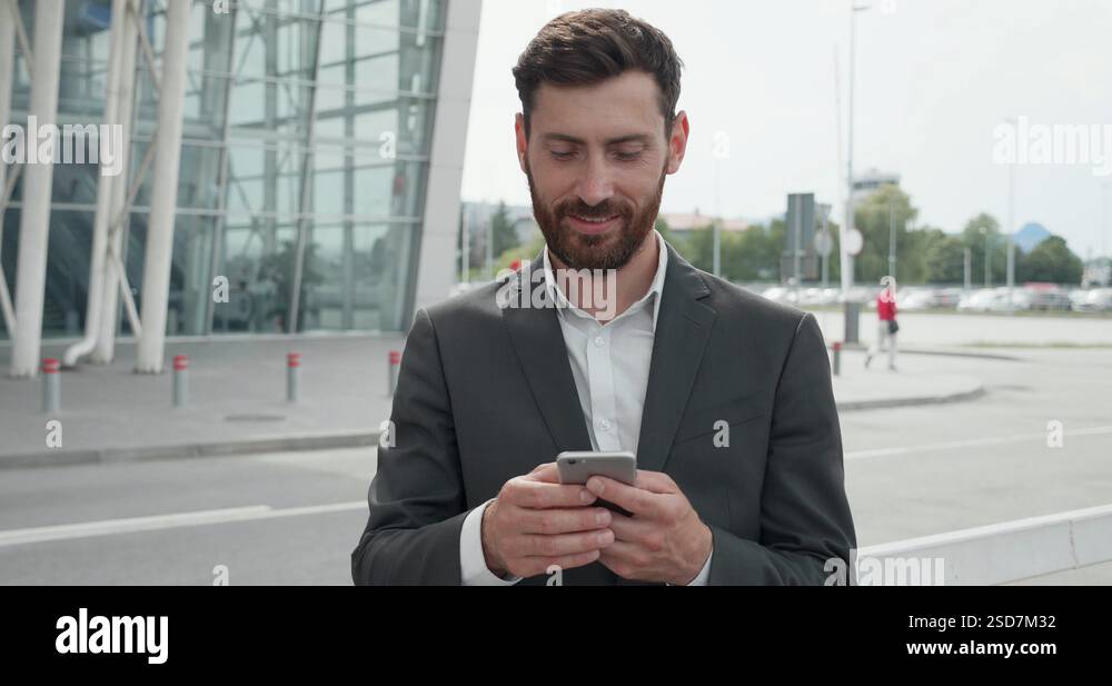 Big Glass Building On The Background Of Happy Man Dressed In Business