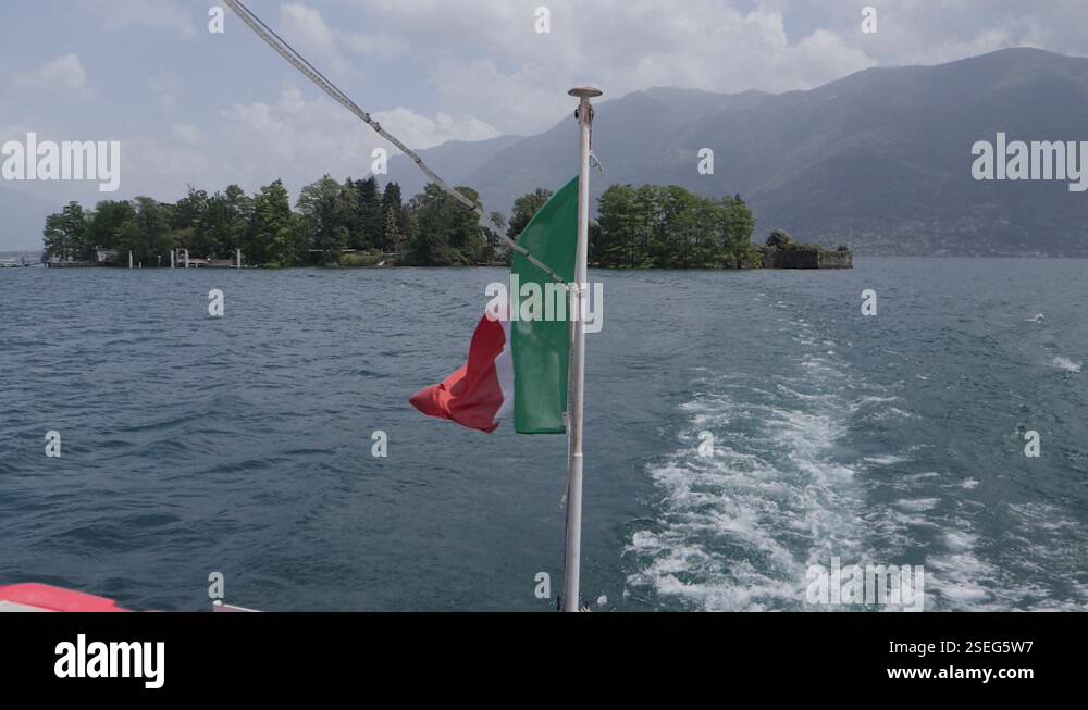 Italy Flag With Coat Of Arms Waving In The Wind Of A Boat Leaving