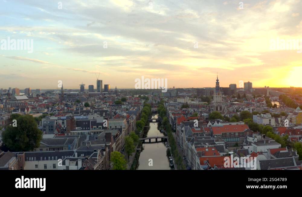 Slow Drone Shot Over Central Amsterdam Canal Zuiderkirk At Sunrise