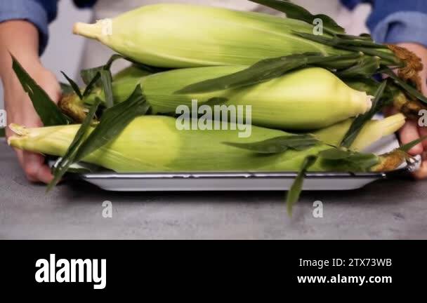 Step By Step Shucking Organic Corn To Make Mexican Corn On The Cob