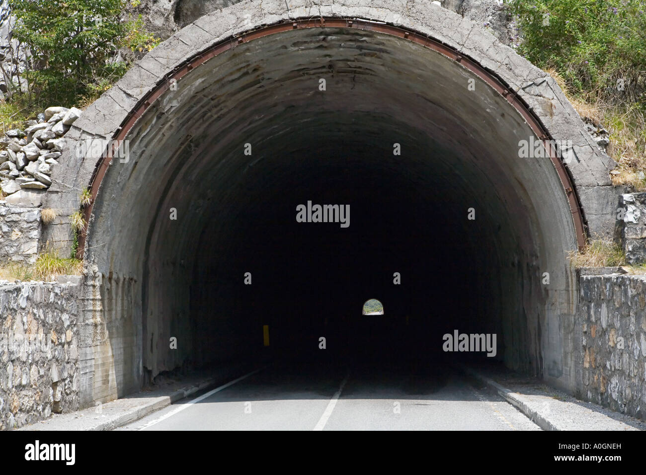 Road-going-into-a-tunnel-A0GNEH.jpg