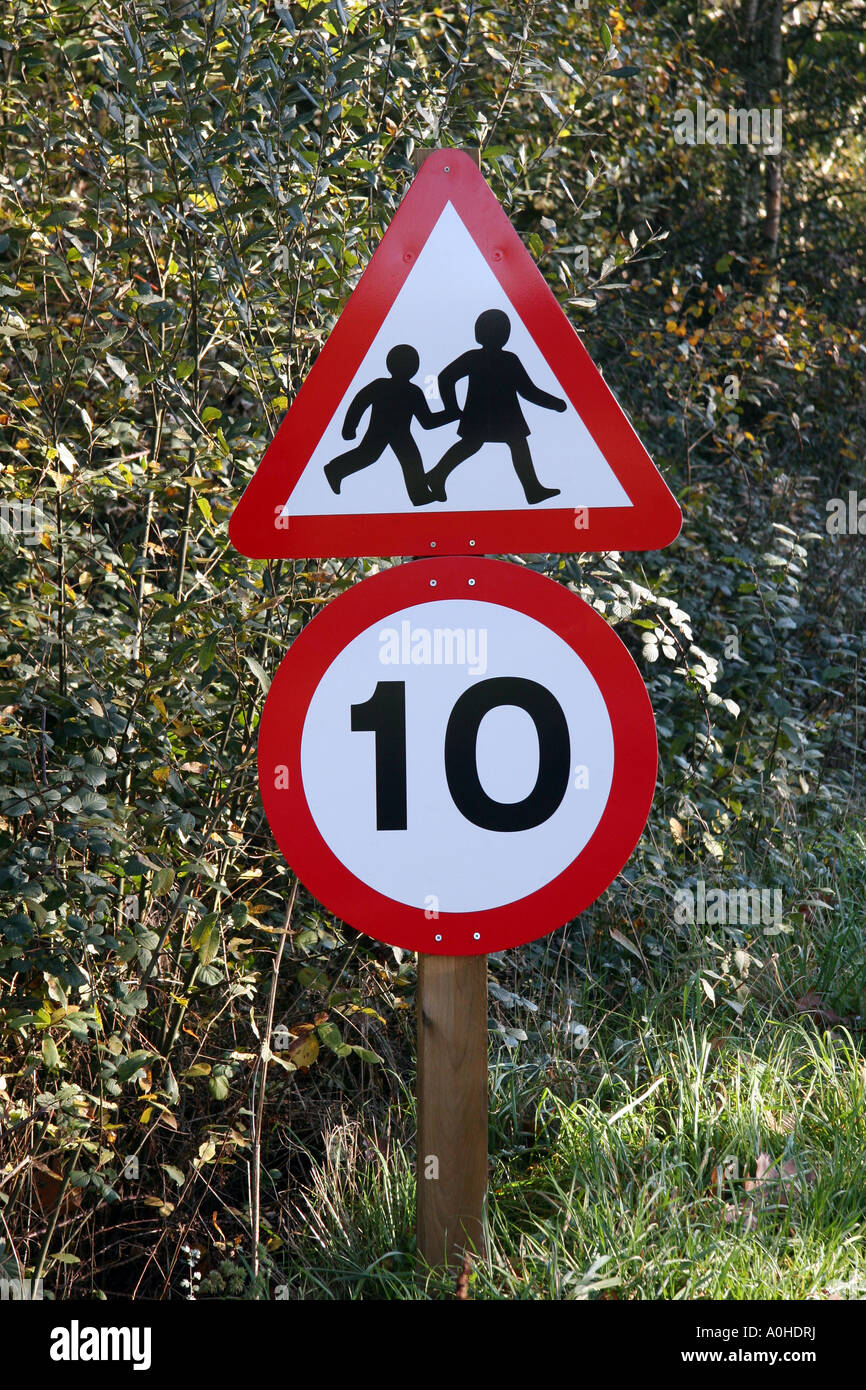 Road Sign Warning Of Children Crossing 10 Mile An Hour Speed Limit Road Sign Warning Of Children Crossing 10 Mile An Hour Speed Limit