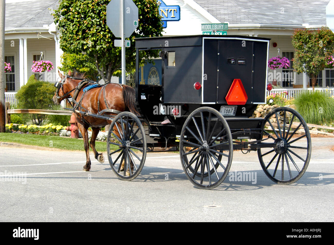 Amish horse drawn buggy on the highway in Shipshewana, Indiana Stock