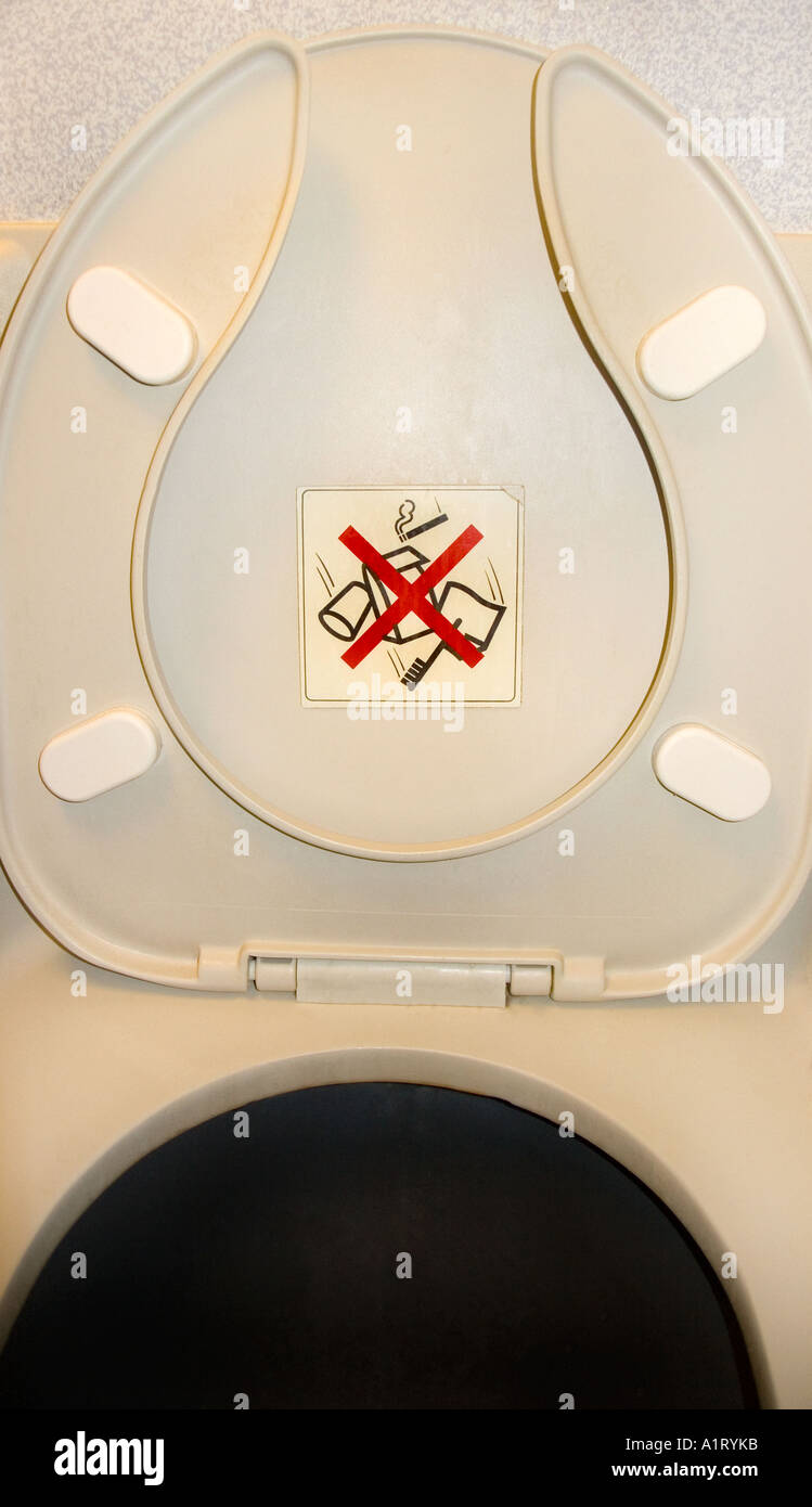 A toilet on a Boeing 747 Warning sign instructs not to dispose of Stock