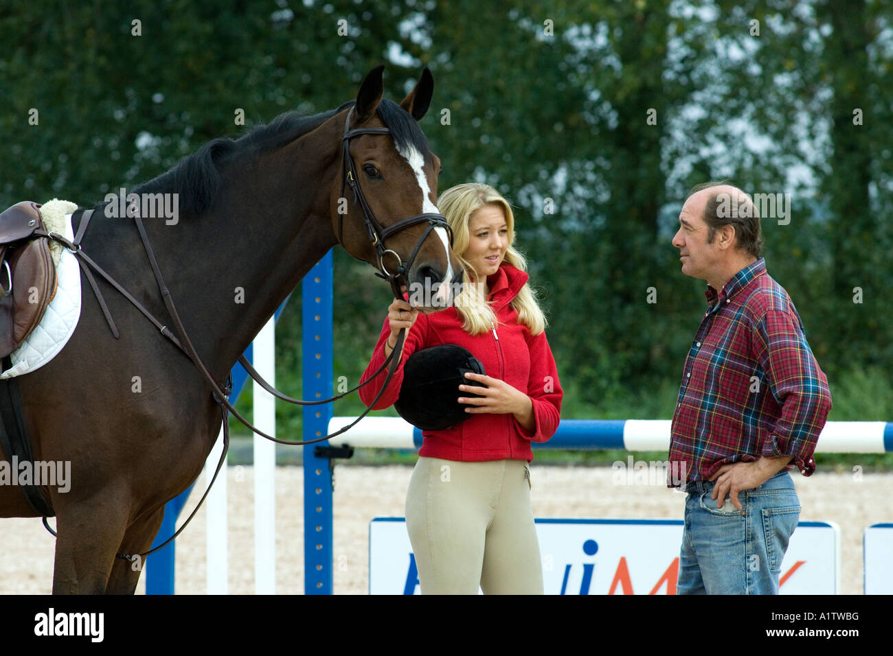 Ellen Whitaker showjumper and equestrian rider with trainer and Stock