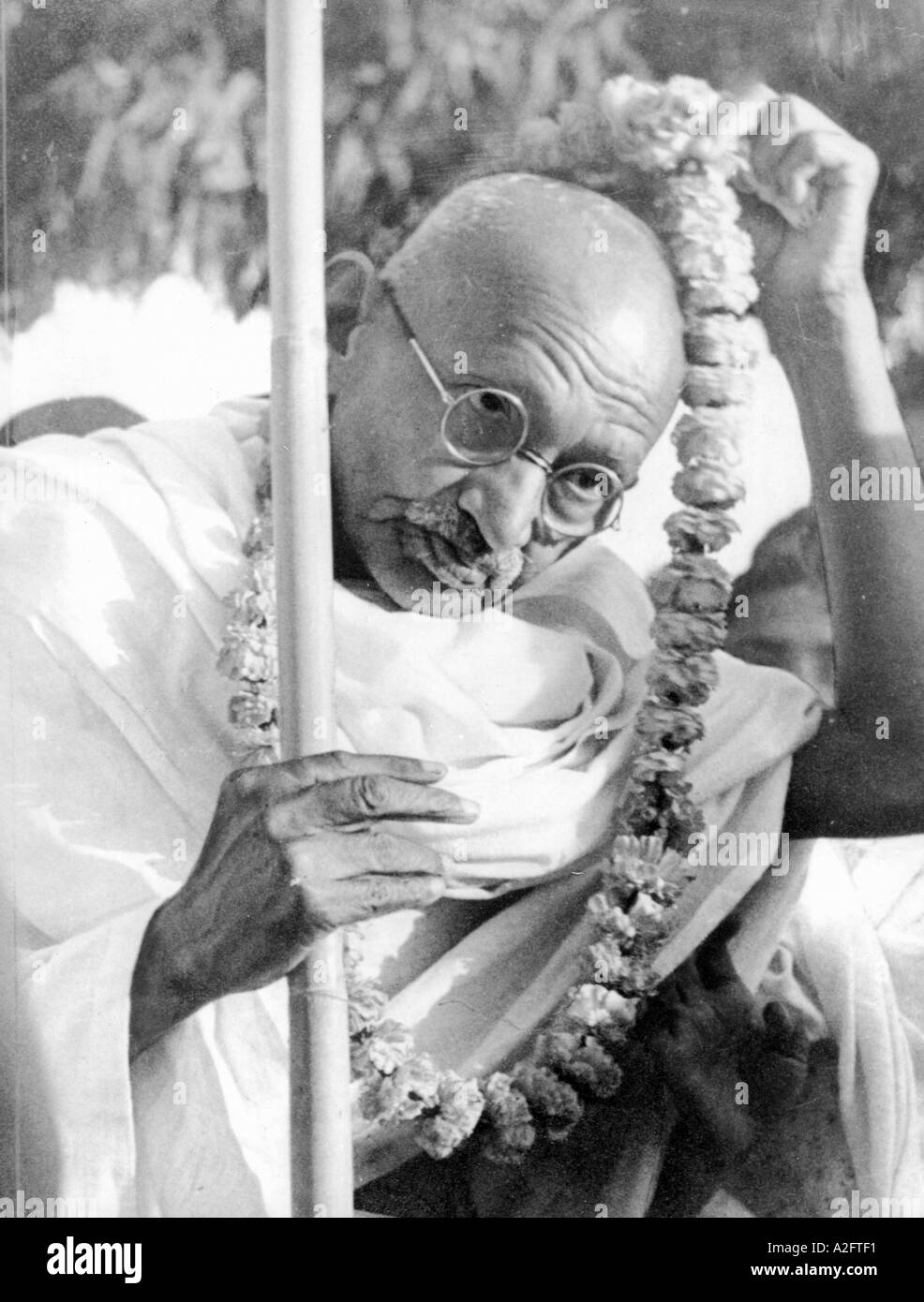 Mahatma Gandhi wearing a flower garland on his way to Noakhali Bengal